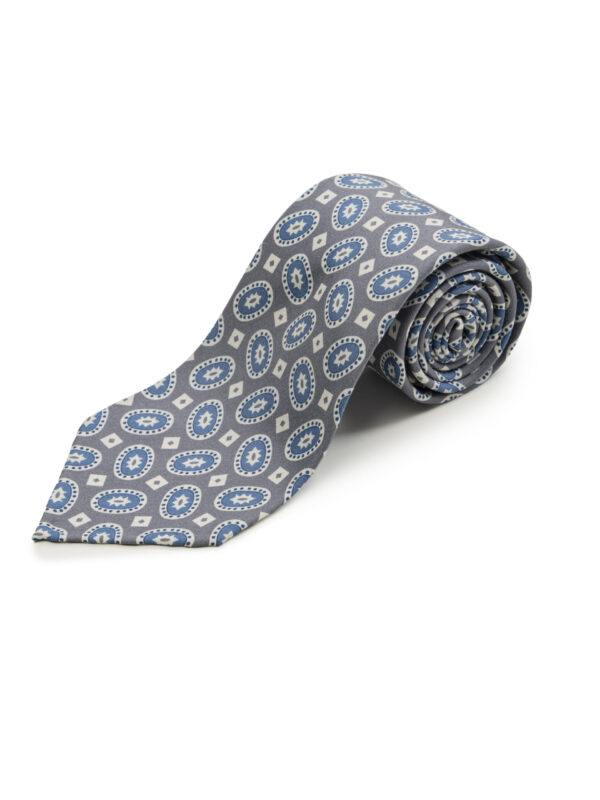 Zwinięty szary krawat z niebiesko-białym wzorem owalnym w stylu retro, wykonany z gładkiej tkaniny.